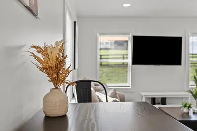 a vase sitting on a table in a room at Creekside Stay | Peaceful Cottage | Elkhorn in Georgetown