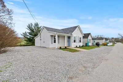 a white house with a driveway at Creekside Stay | Peaceful Cottage | Elkhorn in Georgetown