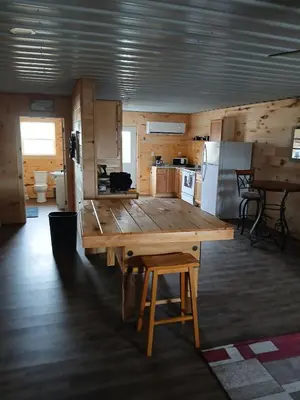 a large wooden table in the middle of a kitchen at A Million Dollar View in Owenton
