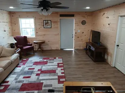 a living room with a couch and a ceiling fan at A Million Dollar View in Owenton