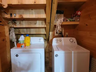 a washer and dryer in a log cabin at Starry Mountain Night- Private Pool, Pool Table in Stanton
