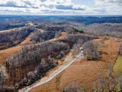 an aerial view of a dirt road in a field at Primrose- Hot Tub, Firepit, Wraparound Deck, WiFi in Wellington