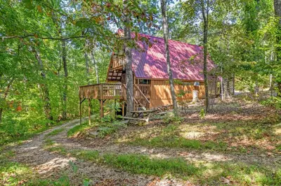 a cabin in the woods with a red roof at Sugar Shack - Cave Run Lake OR Red River Gorge KY in Wellington