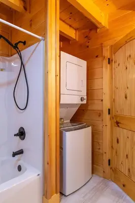 a small kitchen with a refrigerator and a microwave at Cozy Canopy- Hot Tub, Firepit, Covered Deck, WiFi in Stanton
