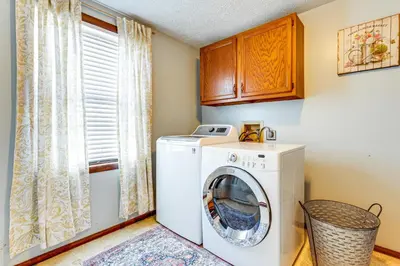 a washing machine in a laundry room with a window at Great for Families! Woodsy Hideaway in Decatur in Decatur