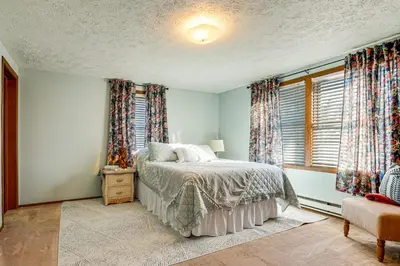 a bedroom with a bed and a window with curtains at Great for Families! Woodsy Hideaway in Decatur in Decatur