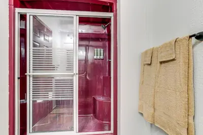 a red window with a towel on a rack at Woodburn Group Getaway Endless On-Site Fun! in Woodburn