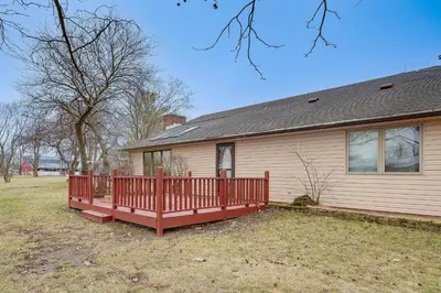 a house with a red fence in front of it at Woodburn Group Getaway Endless On-Site Fun! in Woodburn