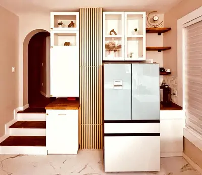 a kitchen with white cabinets and a refrigerator at Downtown Cincinnati Boutique at Newport 3BR with 100in Cinema TV in Dayton