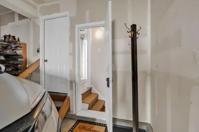 a room with a stairway with a door and a room with a door at The Little Paradise in Morrow