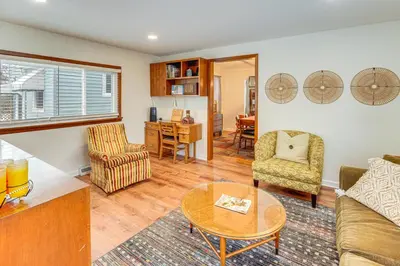 a living room with a couch and chairs and a table at Bring the Family! Mid-Century Modern Gem in Euclid in Euclid