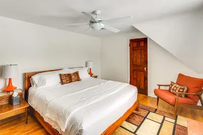 a bedroom with a bed and a ceiling fan at Bring the Family! Mid-Century Modern Gem in Euclid in Euclid