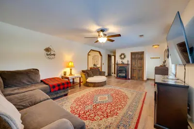 a living room with a couch and a ceiling fan at 5-Acre Hocking Hills Hideaway! Pet-Friendly Home in New Plymouth