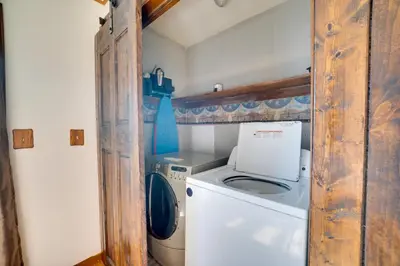 a washer and dryer in a small room at 5-Acre Hocking Hills Hideaway! Pet-Friendly Home in New Plymouth