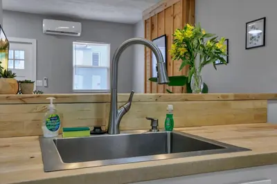 a stainless steel sink in a kitchen at Modern Columbus 2BR Near COSI & Arena District in Columbus