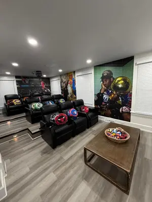 a living room with a couch and a table at New Group Space - Sleeps 20! Near Sports Center in Huron