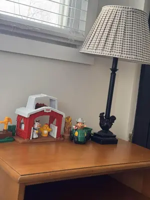 a table with a lamp and toys on it at Logan’s Lookout over Mohican - Modern Farmhouse in Loudonville