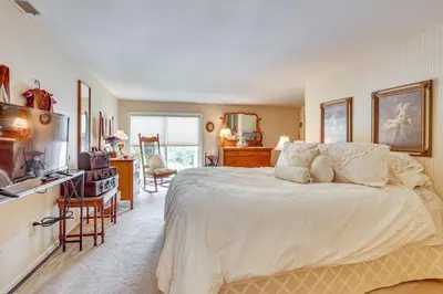 a bedroom with a large white bed in a room at Dalton Retreat w Deck, Fire Pit and 6 Smart TVs in Dalton