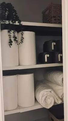 a closet filled with rolls of toilet paper and towels at King suite and Hot Tub near the Greene in Dayton