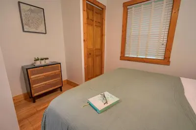 a bedroom with a bed with a book on it at Havenwood in Logan