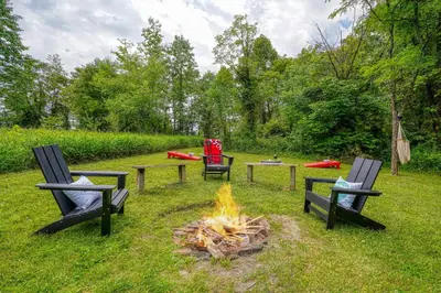 three chairs and a fire pit in a yard at Havenwood in Logan