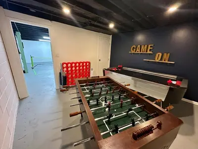 a room with a pool table and a ping pong ball at Mason Ohio Home large private yard firepit game room in Mason