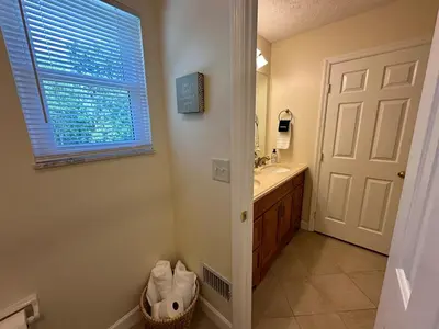 a bathroom with a sink and a mirror at Mason Ohio Home large private yard firepit game room in Mason
