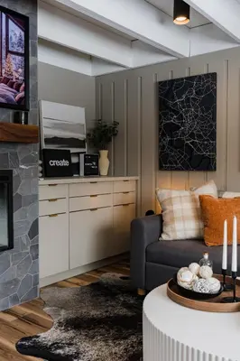 a living room with a couch and a fireplace at Modern Cabin next to Salt Fork State Park