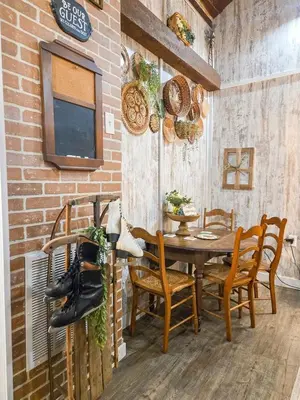 a dining room with a wooden table and chairs at Hot Tub & Firepit Your Winter Blues Retreat in Amherst