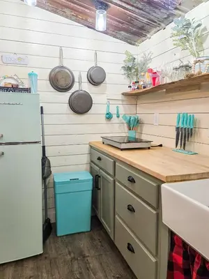a kitchen with a refrigerator and a wooden counter top at Hot Tub & Firepit Your Winter Blues Retreat in Amherst
