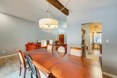 a dining room and living room with a table and chairs at Close to Hospitals and Downtown Cleveland Home in North Olmsted