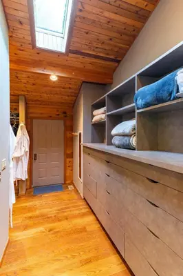a room with a vaulted ceiling with a skylight at Nature Spa House | •Pool •Hot Tub •Sauna •Pvt Lake in New Richmond