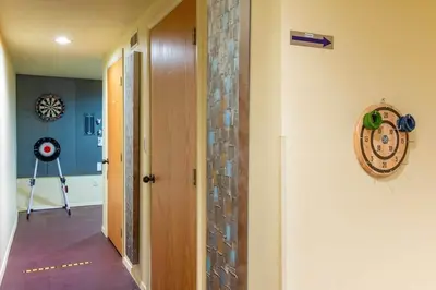 a hallway with a room with a door and a gym at Nature Spa House | •Pool •Hot Tub •Sauna •Pvt Lake in New Richmond