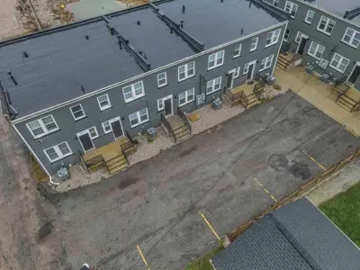 an overhead view of a large building with benches in front at Modern Townhouse in Historic Building Walk to Downtown in Columbus