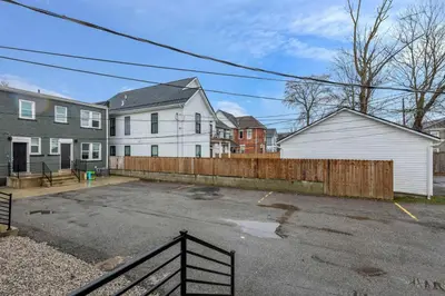 an empty parking lot in front of some houses at Perfect Short Stay in Historic Columbus Walkable Modern & Easy in Columbus