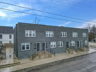 a large brick building on a city street at Perfect Short Stay in Historic Columbus Walkable Modern & Easy in Columbus