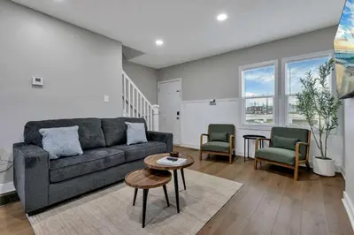 a living room with a couch and two chairs at Perfect Short Stay in Historic Columbus Walkable Modern & Easy in Columbus