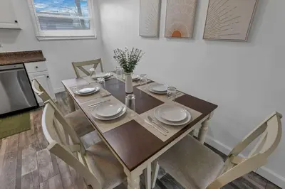 a dining room table and chairs in a kitchen at Modern 4BR Retreat Fenced Yard Near Easton in Columbus