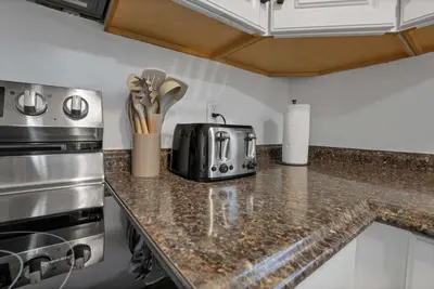 a kitchen with a counter top with a toaster at Modern 4BR Retreat Fenced Yard Near Easton in Columbus