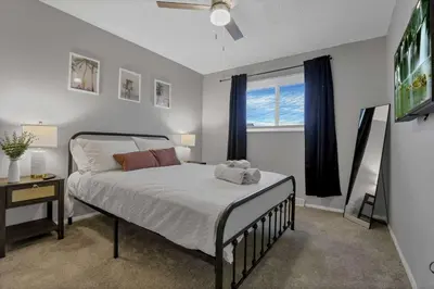 a bedroom with a bed and a window at Modern 4BR Retreat Fenced Yard Near Easton in Columbus