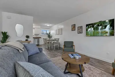 a living room with a couch and a table at Modern 4BR Retreat Fenced Yard Near Easton in Columbus