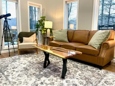 a living room with a couch and a coffee table at Romantic Secluded Hot Tub, Stargazing, Mt View in Stanton
