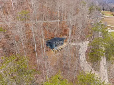 an overhead view of a house in the woods at Romantic Secluded Hot Tub, Stargazing, Mt View in Stanton
