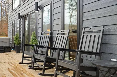 three chairs and a table on a porch at Romantic Secluded Hot Tub, Stargazing, Mt View in Stanton