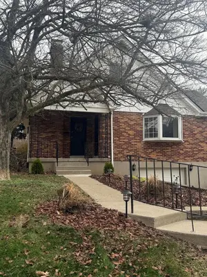 a brick house with a tree in front of it at 2 bedroom hot tub home near NKU in Cold Spring