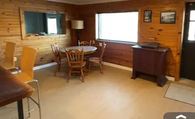 a dining room with a table and chairs at Slice of Petersburg