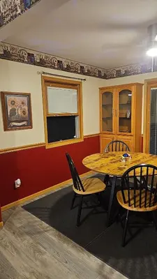 a dining room with a table and chairs at Spacious Family Retreat with ADA Ramp and ADA bathroom in Maumee