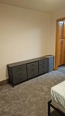 a bedroom with a dresser in a room at Spacious Family Retreat with ADA Ramp and ADA bathroom in Maumee