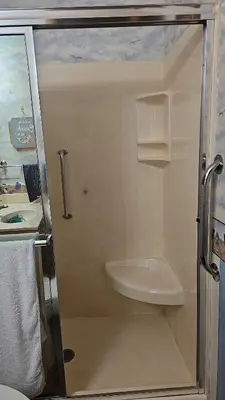 a small bathroom with a toilet and a sink at Spacious Family Retreat with ADA Ramp and ADA bathroom in Maumee