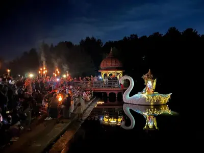 a large crowd of people watching a parade at night at Aniyor Apartment Loft